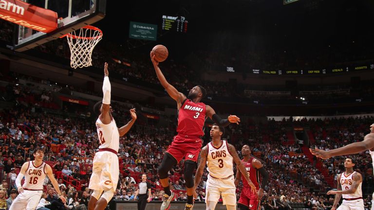 Dwyane Wade soars to score with a finger roll against Cleveland