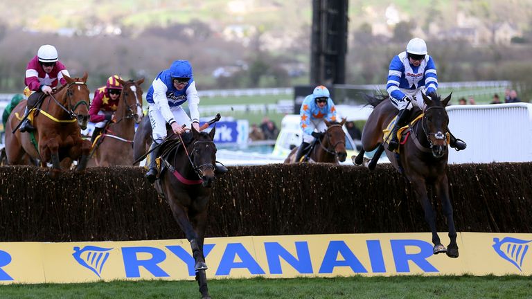Frodon (right) trails Aso jumping the last in the Ryanair