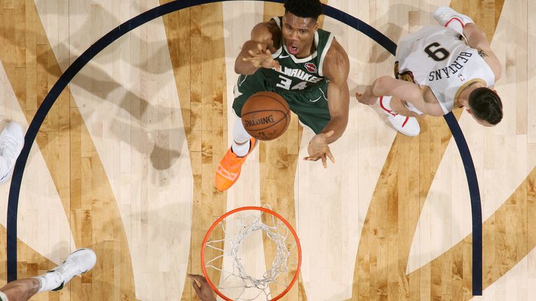 Giannis Antetokounmpo finishes at the basket against New Orleans