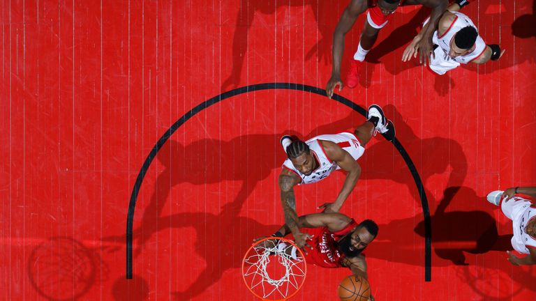 James Harden scores with a left-handed finish against Toronto