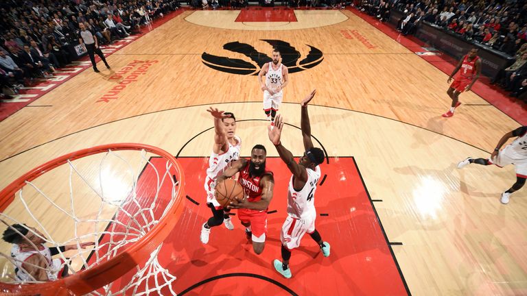 James Harden drives to the hoop against Toronto