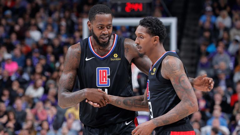 JaMychal Green congratulates Clippers team-mate Lou Williams 