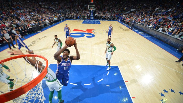 Joel Embiid absorbs contact to score against Boston
