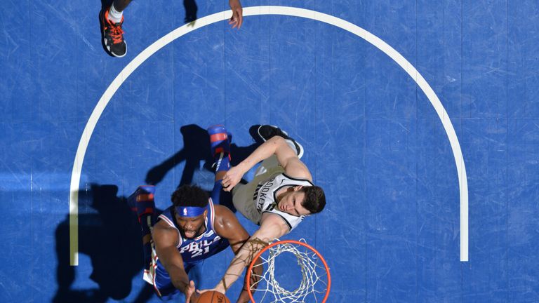Joel Embiid finishes at the rim against Brooklyn
