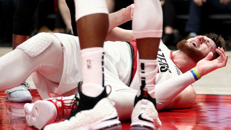 Jusuf Nurkic reacts in anguish after suffering a serious leg injury against Brooklyn