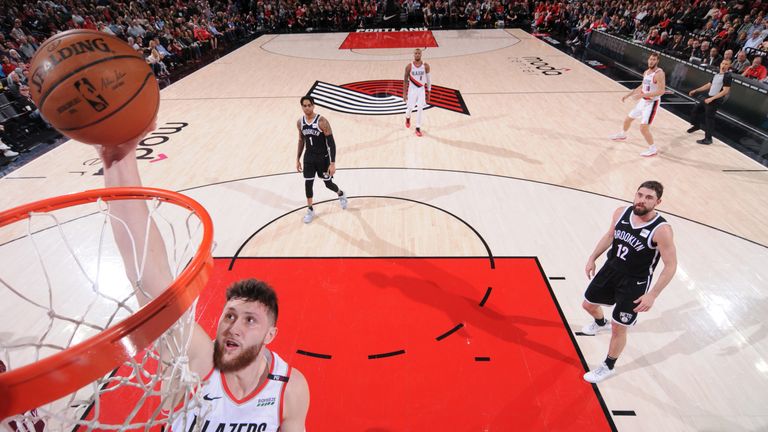 Jusuf Nurkic rams home a dunk against the Nets