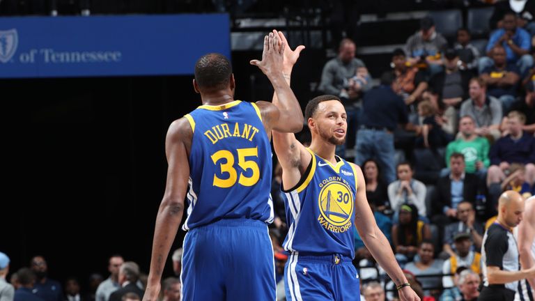 Kevin Durant and Stephen Curry share a high-five