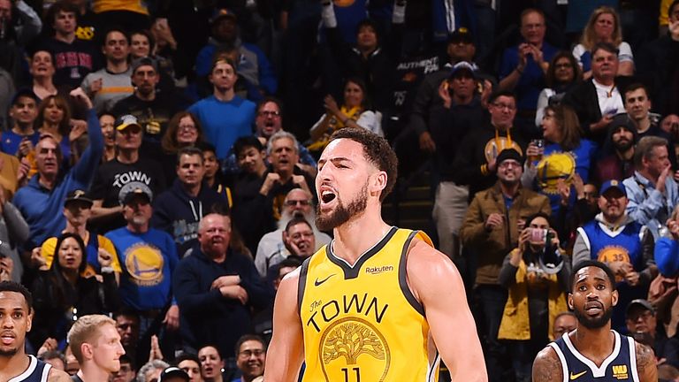 Klay Thompson celebrates after making a big shot against Denver