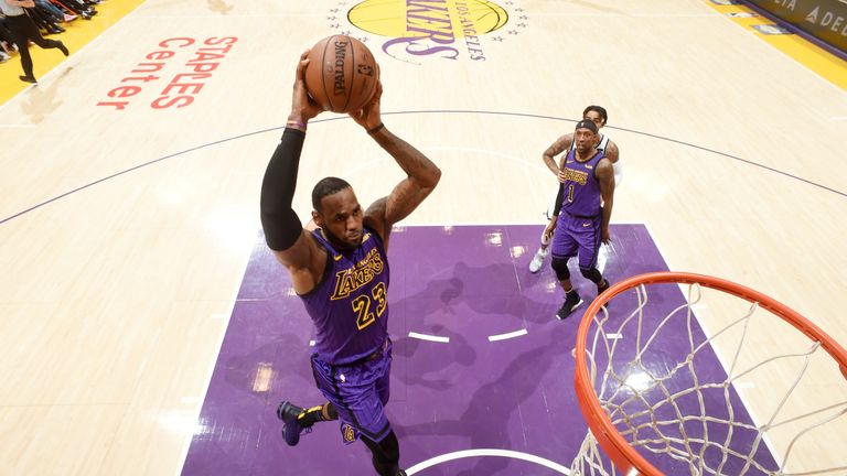 LeBron James hammers home a dunk in the Lakers' loss to the Brooklyn Nets