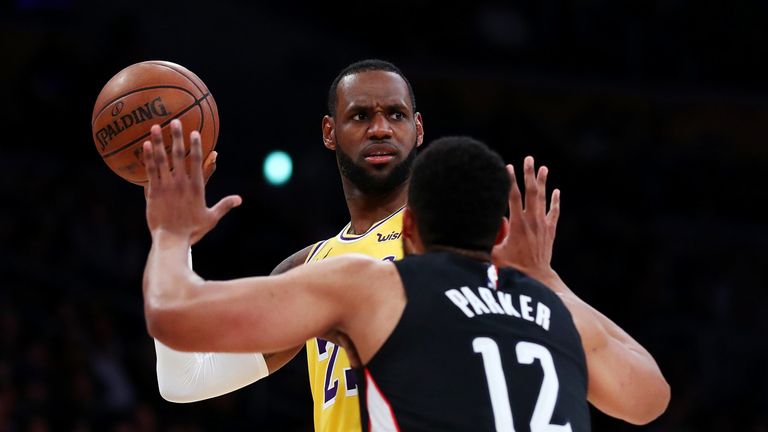 LeBron James sets to fire a pass against Washington