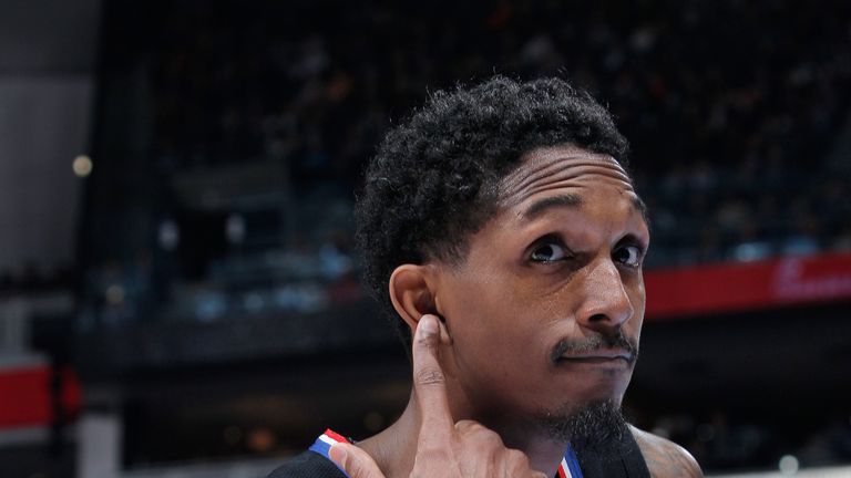 Lou Williams gestures for fans to make more noise