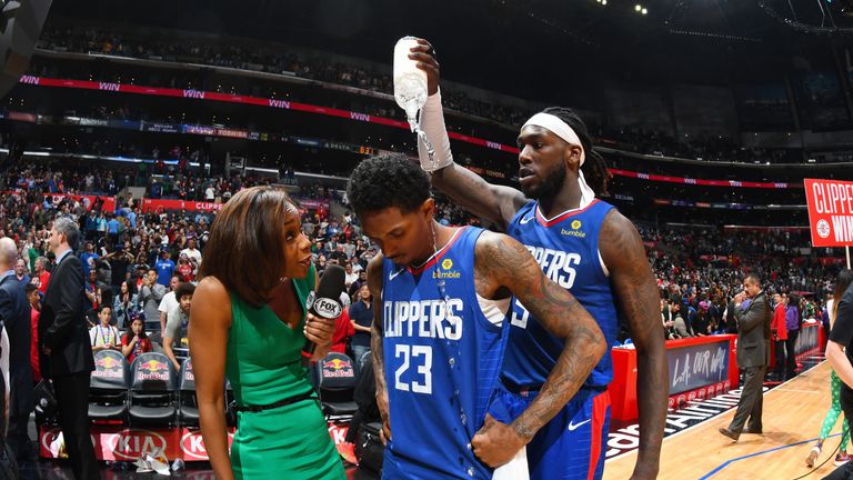 Montrezl Harrell cools off Lou Williams after the guard hit a game-winning buzzer beater against the Brooklyn Nets