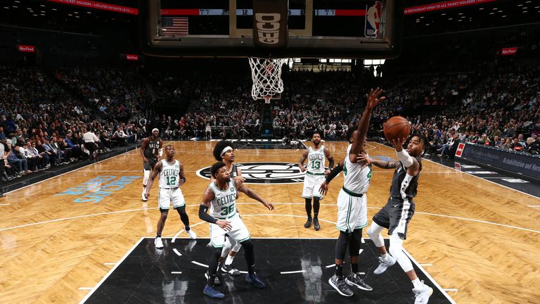 D'Angelo Russellon shoots from close to the basket against the Boston Celtics