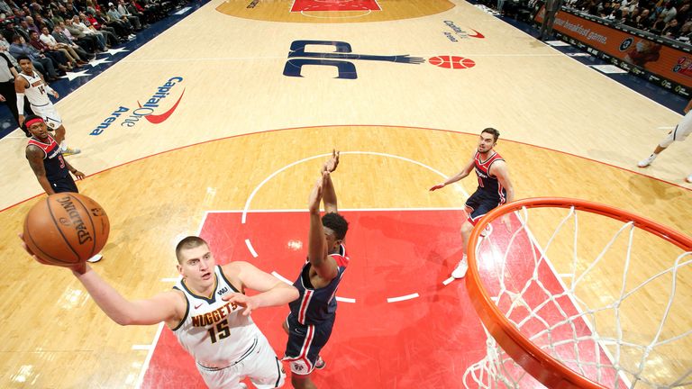 Nikola Jokic launches a jump hook against the Wizards