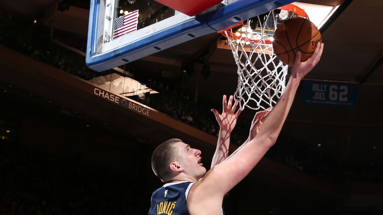 Nikola Jokic scores with a lay-up against the New York Knicks
