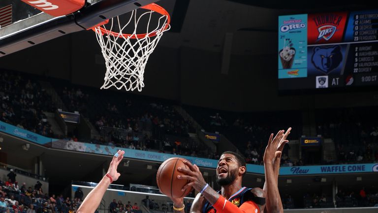 Paul George attacks the basket against Memphis