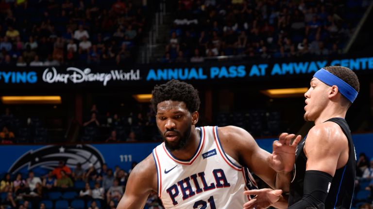 Joel Embiid battles with Aaron Gordon