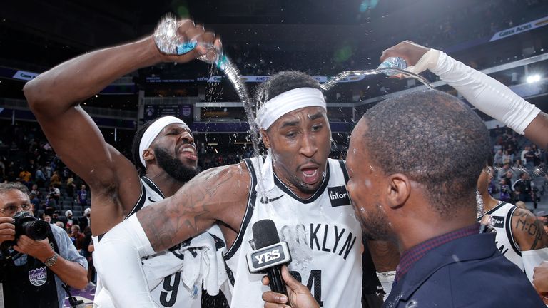 Rondae Hollis-Jefferson is showered with water by his team-mates after hitting a last-second game-winner for the Brooklyn Nets