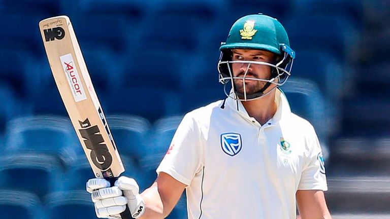 Aiden Markram  raises his bat as he celebrates after scoring half century (50 runs) during the first day of the third Cricket Test match between South Africa and Pakistan at Wanderers cricket stadium in Johannesburg on January 11, 2019.