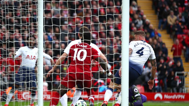 Toby Alderweireld scores a late own goal at Anfield to hand Liverpool a crucial win