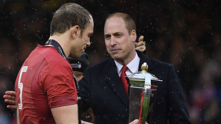 Prince William hands over the trophy to Wales' lock Alun Wyn Jones after Wales beat Ireland