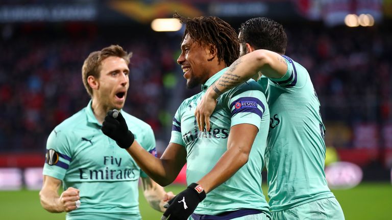 Alex Iwobi celebrates with Arsenal team-mate Granit Xhaka and Nacho Monreal after scoring 