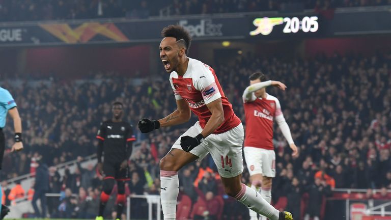 Pierre-Emerick Aubameyang celebrates the opener against Rennes at the Emirates