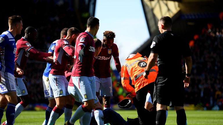 Supporter is taken to the ground after attacking Jack Grealish