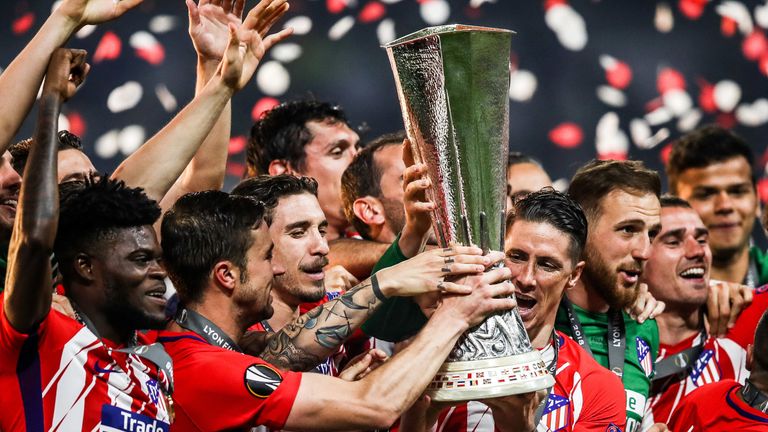 Atletico Madrid celebrate with the Europa League trophy