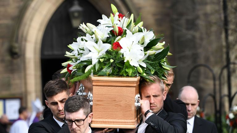 Pallbearers Joe Anyon, Kasper Schmeichel, Jack Butland and Joe Hart carry Banks' coffin after the funeral service at Stoke Minister