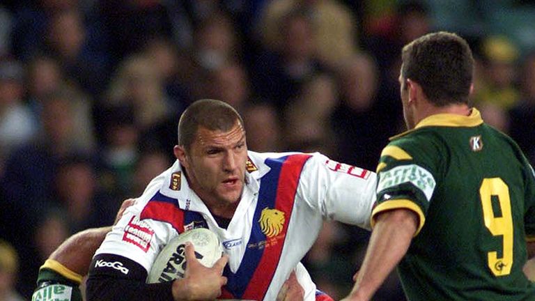 Barrie McDermott of the Lions tries to break through Shane Webcke of the Kangaroos 