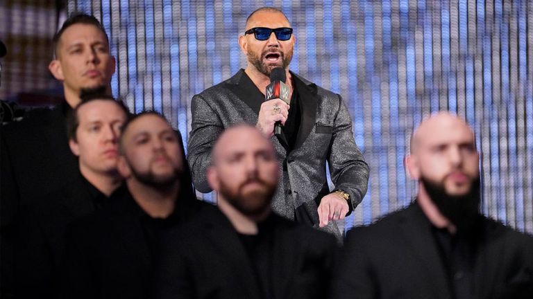 A heavily-guarded Batista was on Raw last night to set up a match with Triple H