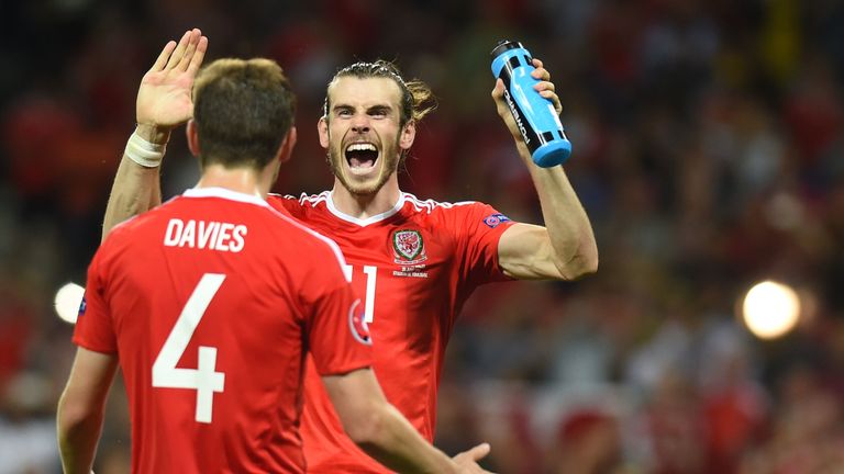 Ben Davies celebrates with Gareth Bale