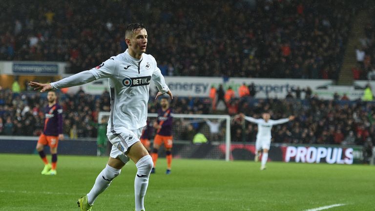 Bersant Celina celebrates scoring against Manchester City