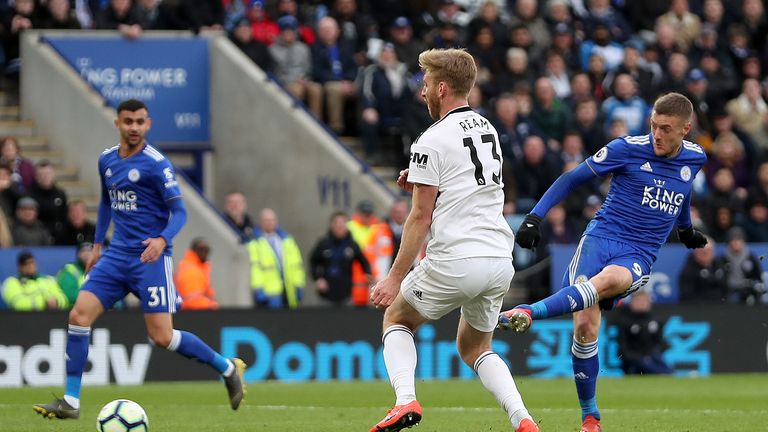 Jamie Vardy strokes in his second of the game against Fulham