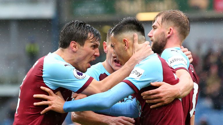 Burnley's Dwight McNeil celebrates after scoring his team's first goal with Jack Cork