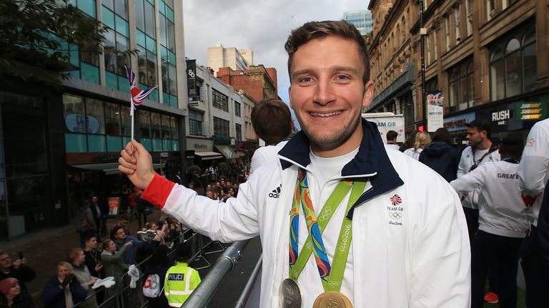 Callum Skinner with gold and silver medals at 2016 Olympics victory parade in UK