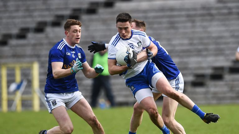 Shane Carey of Monaghan in action against Ciaran Brady and Niall Murray of Cavan