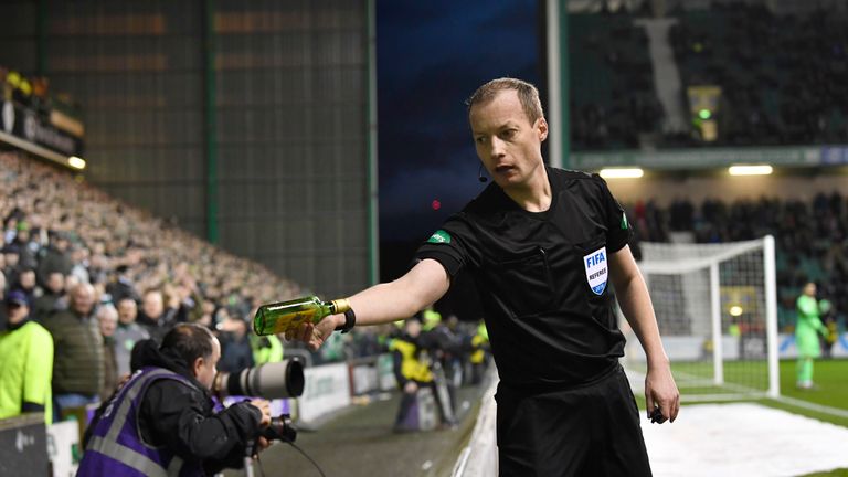 02/03/19 WILLIAM HILL SCOTTISH CUP QUARTER - FINALS.HIBERNIAN v CELTIC.EASTER ROAD - EDINBURGH.Referee William Collum removes a bottle from the pitch, which was thrown from the stands