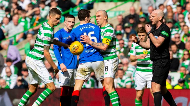 Scott Brown clashes with Andy Halliday during Celtic vs Rangers