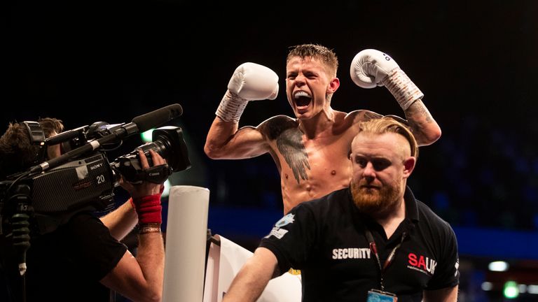 Charlie Edwards celebrates after successfully defending his WBC flyweight crown