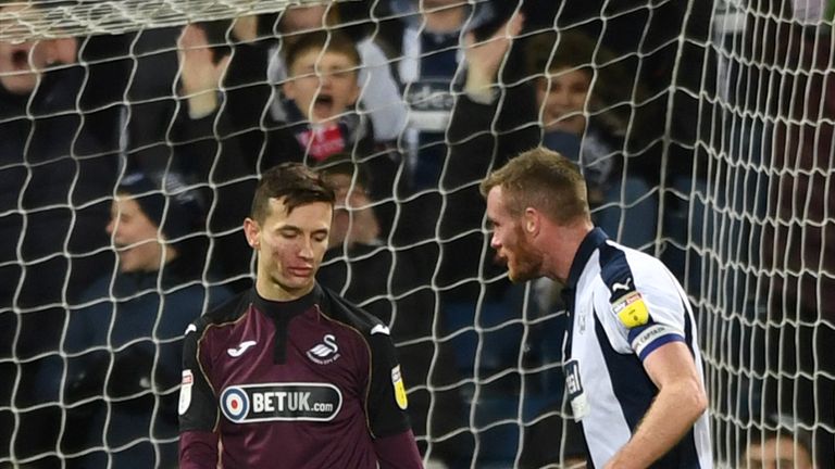 WBA player Chris Brunt has words with Swansea player Bersant Celina after he had missed a penalty during the Sky Bet Championship match between West Bromwich Albion and Swansea City at The Hawthorns on March 13, 2019 in West Bromwich, England
