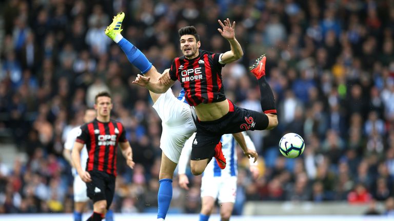 Christopher Schindler of Huddersfield Town collides with Alireza Jahanbakhsh of Brighton