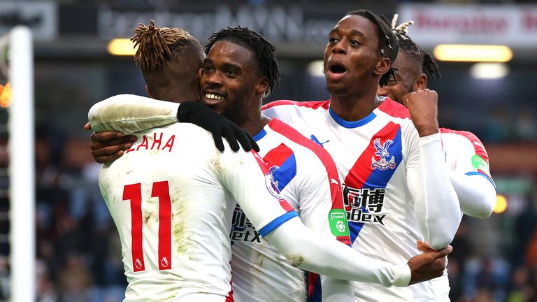 Wilfried Zaha of Crystal Palace celebrates after scoring his team&#39;s third goal with his team mates during the Premier League match between Burnley FC and Crystal Palace at Turf Moor on March 02, 2019 in Burnley, United Kingdom. 