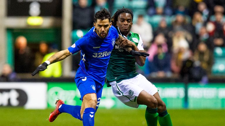 Rangers Daniel Candeias (left) and Hibernian&#39;s Stephane Omeonga in action