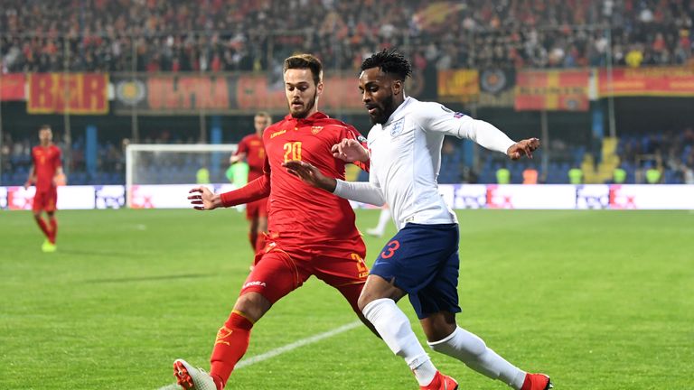 Danny Rose takes on Mirko Ivanic during England's European Qualifier against Montenegro