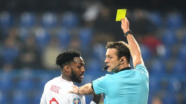 England&#39;s Danny Rose receives a yellow card against Montenegro in the European Qualifiers.
