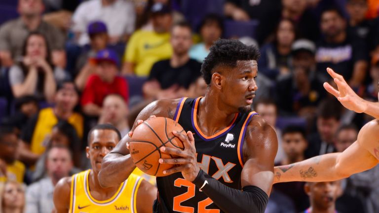 Deandre Ayton #22 of the Phoenix Suns looks to pass the ball during the game against JaVale McGee #7 of the Los Angeles Lakers on March 2, 2019 at Talking Stick Resort Arena in Phoenix, Arizona.