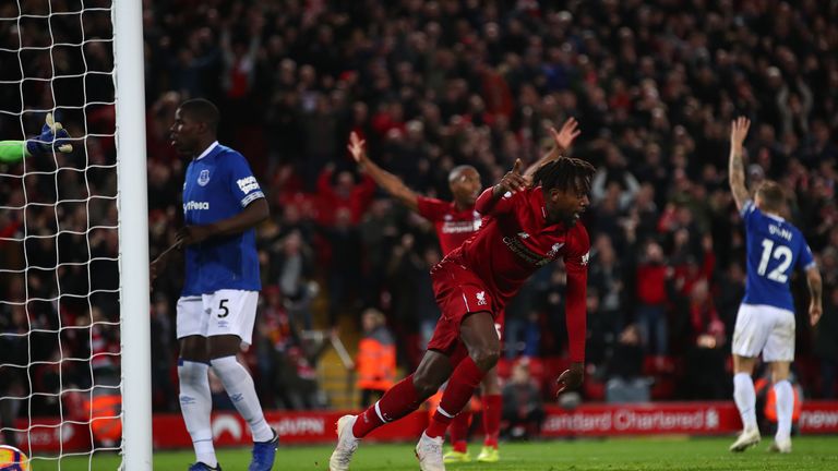 Divock Origi celebrates scoring his 96th-minute winner in December