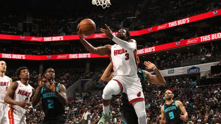 Dwyane Wade of the Miami Heat looks to shoot layup against the Charlotte Hornets